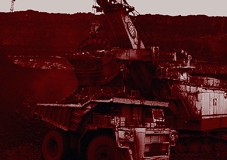 Excavator loading a haul truck